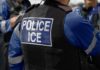 Sanctuary Showdown Over Child Abuse Suspects Close-up of a police officer's vest with 'POLICE ICE' label