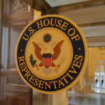US House of Representatives seal on glass door