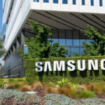 Samsung building with large sign and greenery.
