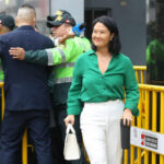 I dont know who they are. Woman in green shirt smiling.