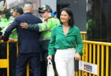 I dont know who they are. Woman in green shirt smiling.