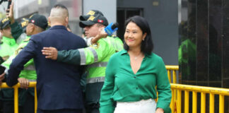 I dont know who they are. Woman in green shirt smiling.