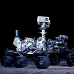 Mars rover with six wheels and camera mast on dark background