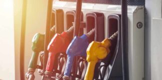 Fuel pump nozzles in multiple colors at a gas station