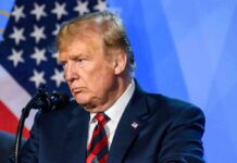 Defense Or Deterrence? The Debate Continues man at podium speaking into microphone