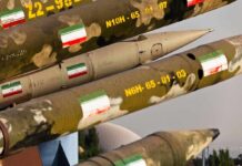Iran Claims New Attacks Across The Gulf Row of military missiles with camouflage and national flags