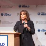 Woman speaking at a podium with microphone