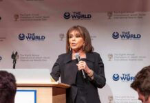 Woman speaking at a podium with microphone
