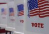 Voting booths with American flag graphics