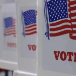 Voting booths with American flag graphics