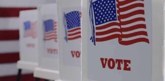 Voting booths with American flag graphics