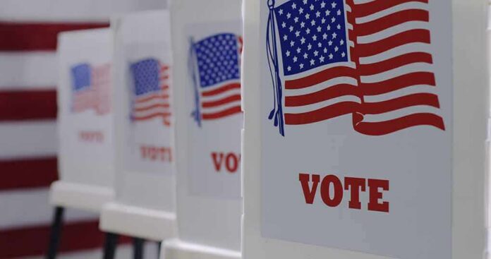 Voting booths with American flag graphics