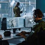 Military Planners Rethink Pressure On Iran Military analysts at computers in a command center