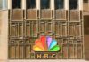 NBC peacock logo on building facade