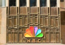 NBC peacock logo on building facade