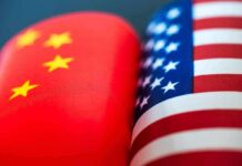 America And China Just Found A Narrow Trade Lane Chinese and American flags side by side