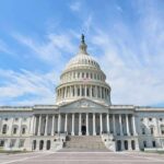 United States Capitol building with dome under a blue sky