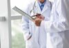 Doctors reviewing a clipboard
