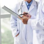 Doctors reviewing a clipboard