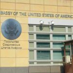 United States Embassy exterior with signage and seal