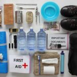 Emergency kit items organized on a white surface