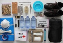 Cash, Cans, Water—Why Officials Want Them Ready Emergency kit items organized on a white surface