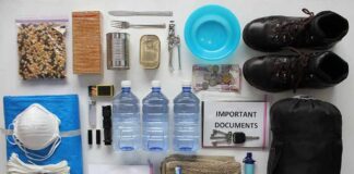 Emergency kit items organized on a white surface