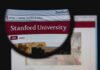 Close-up view of Stanford Universitys website through a magnifying glass
