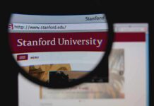 Close-up view of Stanford Universitys website through a magnifying glass