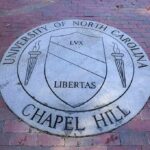 Questions Swirl Before The Season Even Starts Stone university seal inset in a brick walkway