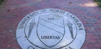 Stone university seal inset in a brick walkway
