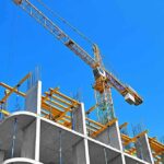 A Construction Crisis Shakes Midtown Manhattan Tower crane over concrete building under construction