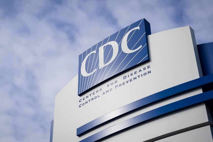 CDC headquarters sign against a cloudy sky