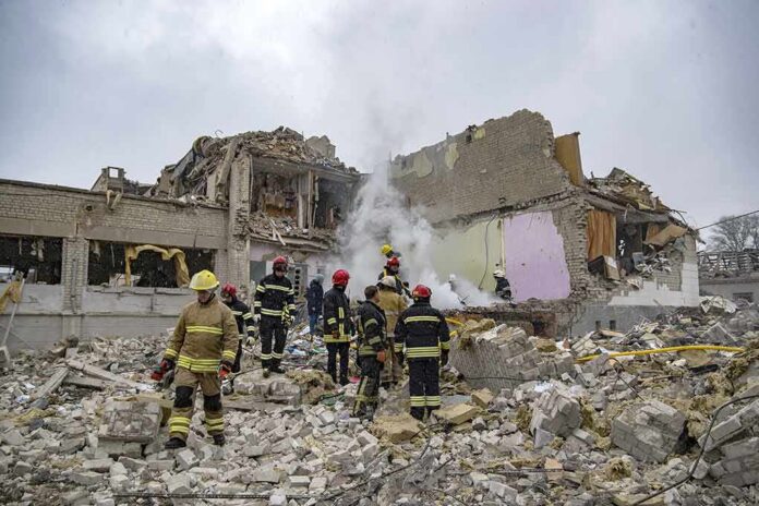 Firefighters search rubble of a partially collapsed building