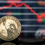 U.S. dollar coin in front of falling stock chart