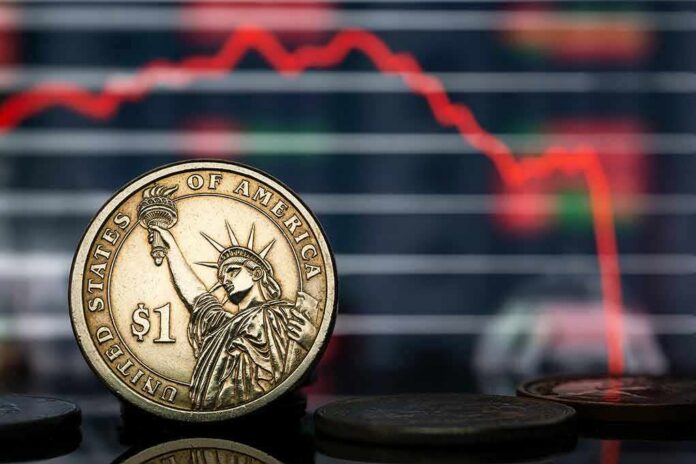 U.S. dollar coin in front of falling stock chart