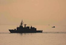 Sanctions For Passage? Trump Torches Plan naval ship silhouette at sea during sunset