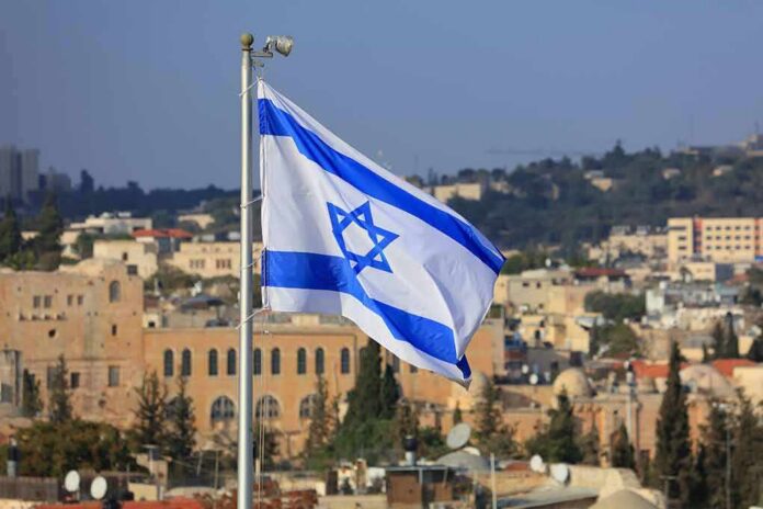 Israeli flag waving over a cityscape