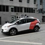 When Every Drive Leaves A Government Trail Autonomous test car with roof sensors on a city street