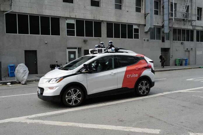 Autonomous test car with roof sensors on a city street