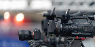 Professional video cameras on tripods