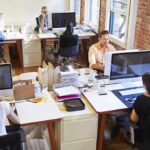 Open-plan office with employees working at desks