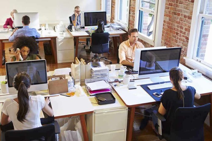 shutterstock_289559477 Open-plan office with employees working at desks