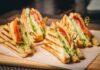 Club sandwich quarters on a wooden board