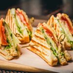 Club sandwich quarters on a wooden board