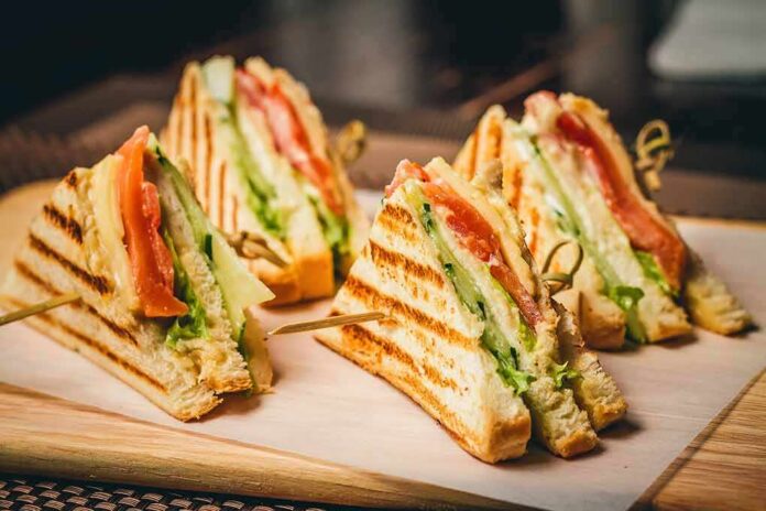 Club sandwich quarters on a wooden board