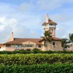 Sealed Affidavit, Unanswered Questions Explode Mediterranean-style seaside mansion with tower and palm trees