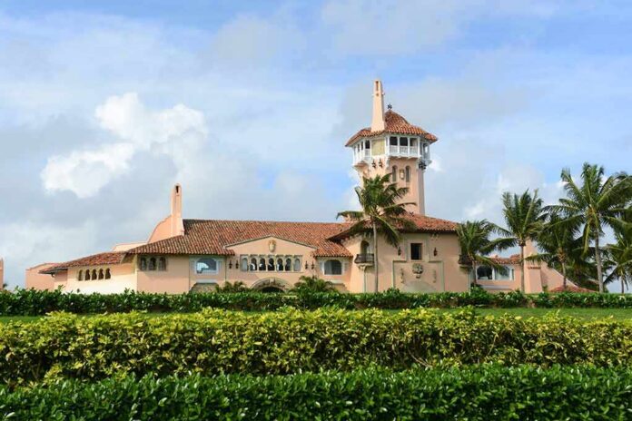 Mediterranean-style seaside mansion with tower and palm trees