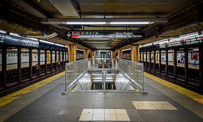 Subway platform with stairwell and tracks on both sides