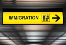 Immigration sign with arrow in airport